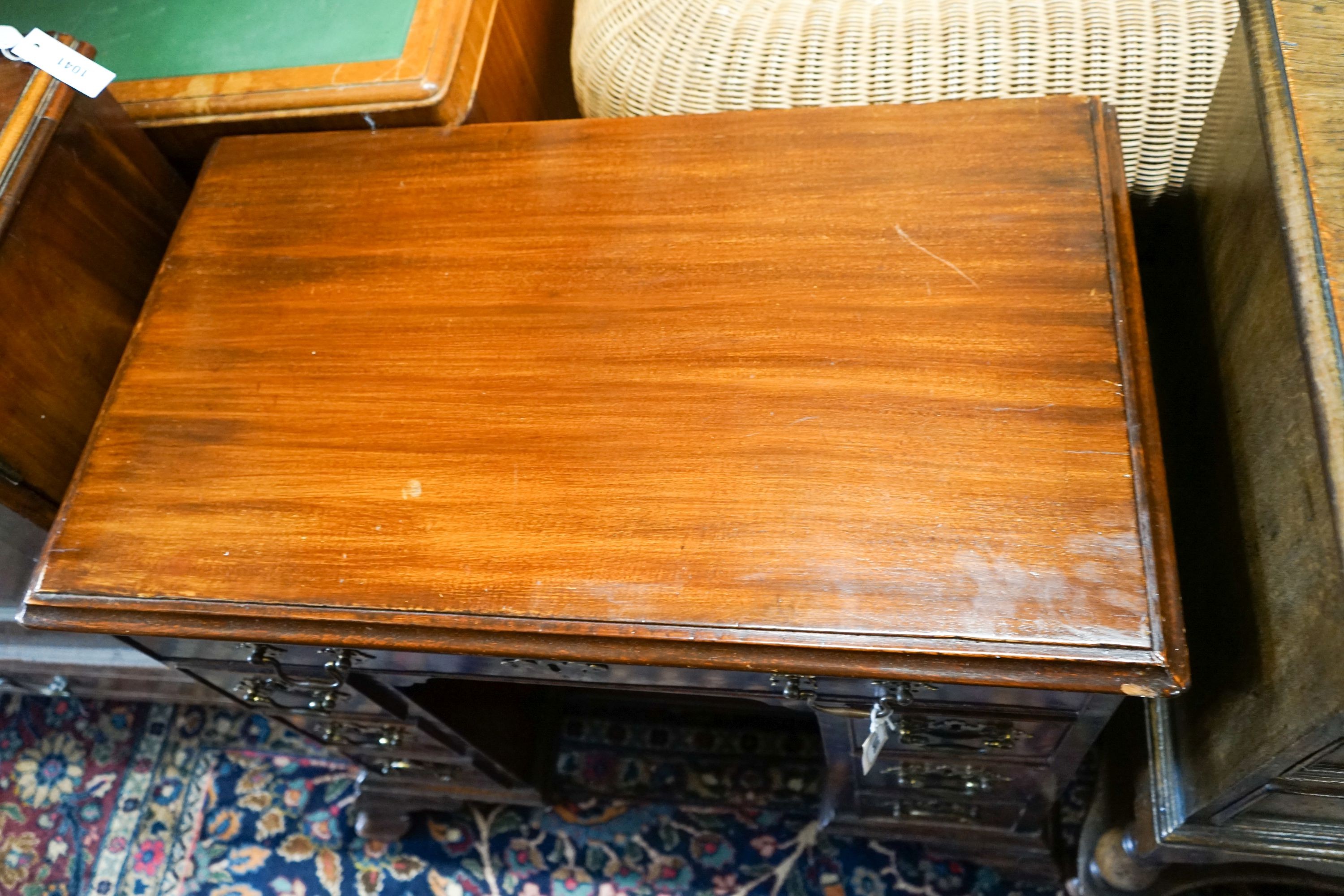 A George III and later mahogany kneehole desk, fitted seven drawers and recessed cupboard on ogee bracket feet, width 81cm, depth 47cm, height 71cm